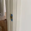 A crisp painted edge around a home's door trim shows the careful finish expected from reliable painting services.