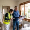 A homeowner and painter discuss room access and timing for an upcoming home painting project.