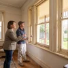 A homeowner and painter discuss the timber window trim in a Kew period home before deciding on the painting work.